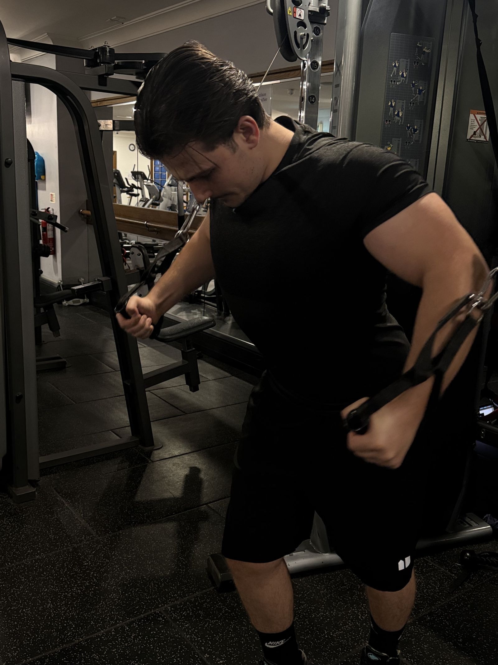 Zak training on the cable machine
